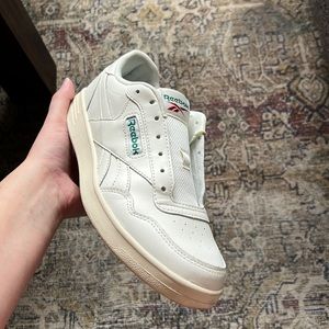 Cream Reebok sneakers with green detail